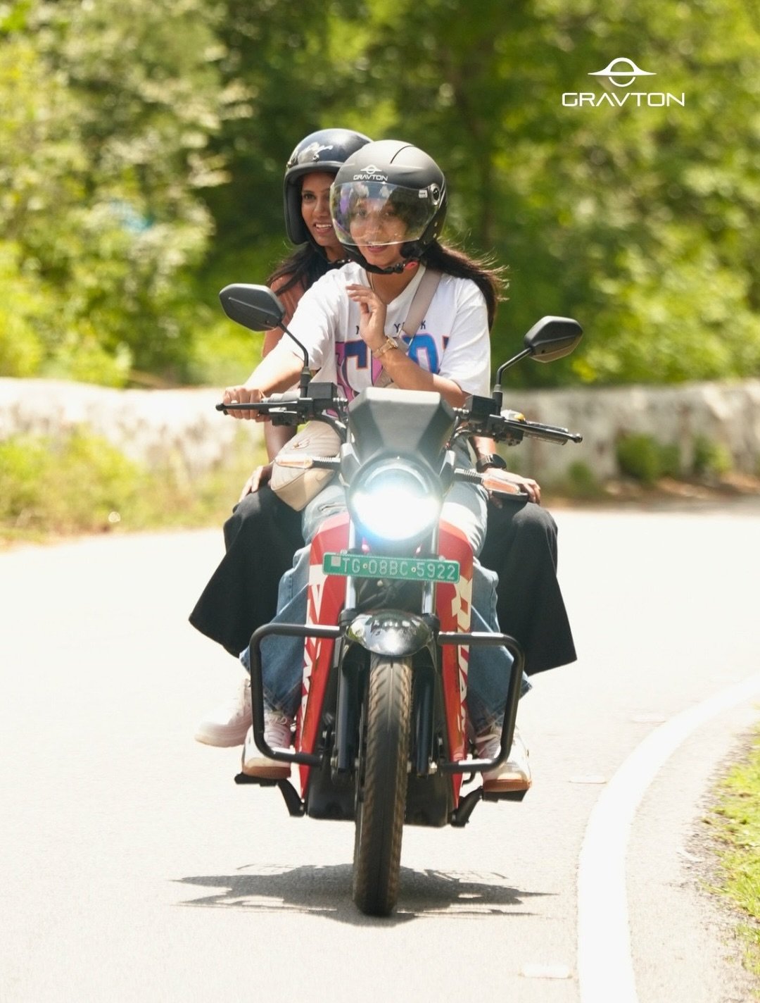 Rider and pillion on the Gravton Quanta